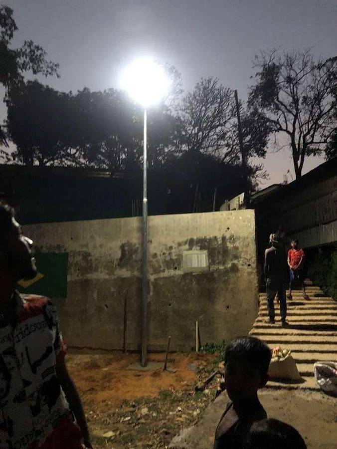 The same lane in Rangamati at night with the street light on